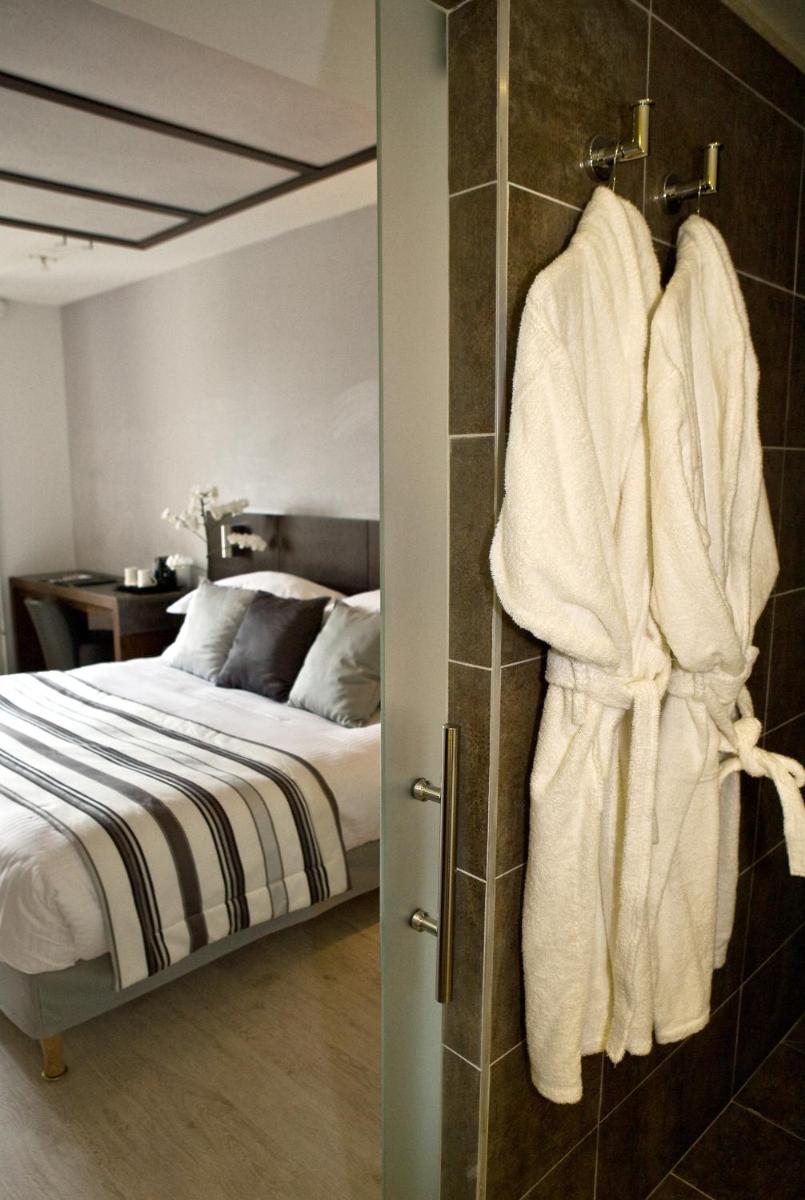 Un ou plusieurs lits dans un hébergement de l'établissement Best Western Plus Hotel des Francs