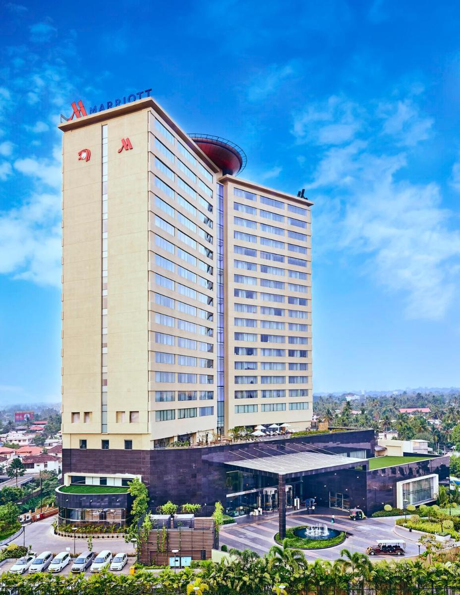a hotel with a large building with a funnel at Kochi Marriott Hotel in Cochin