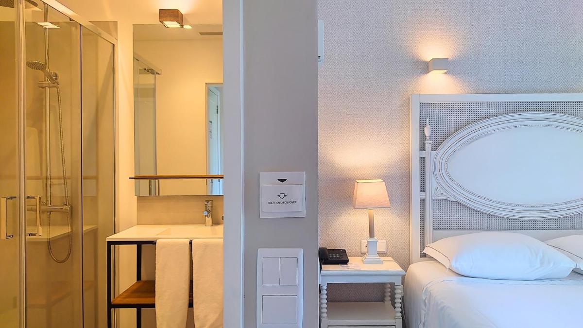Uma cama ou camas num quarto em Grande Hotel das Caldas da Felgueira
