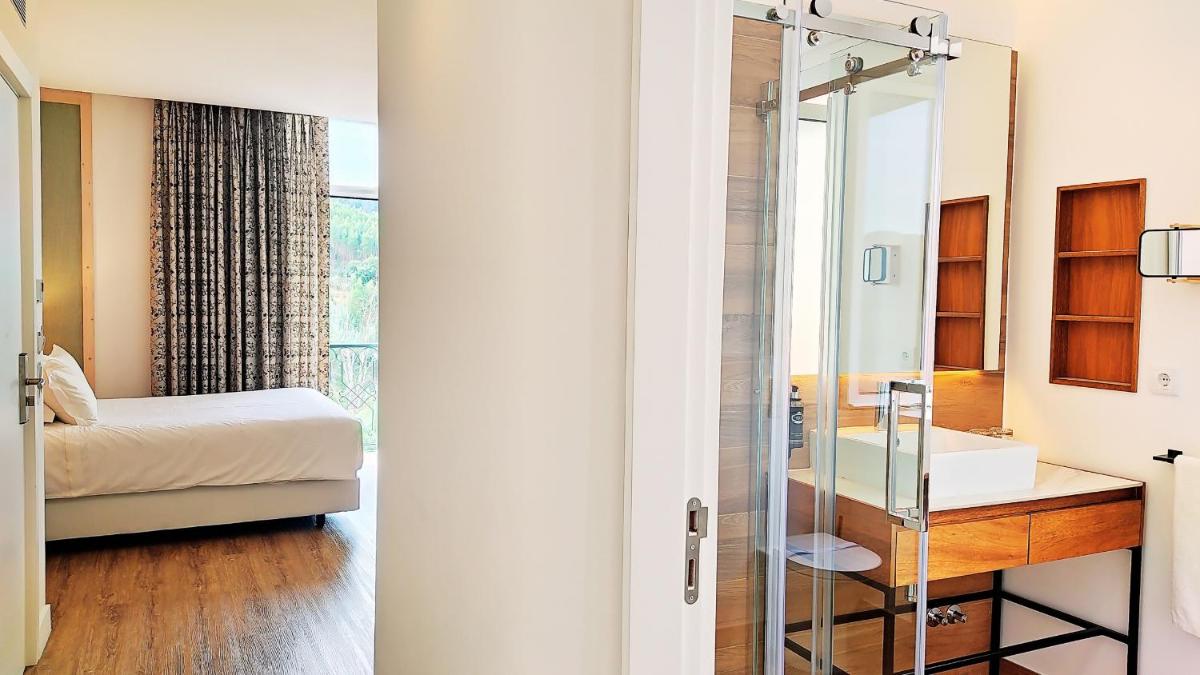 Uma cama ou camas num quarto em Grande Hotel das Caldas da Felgueira