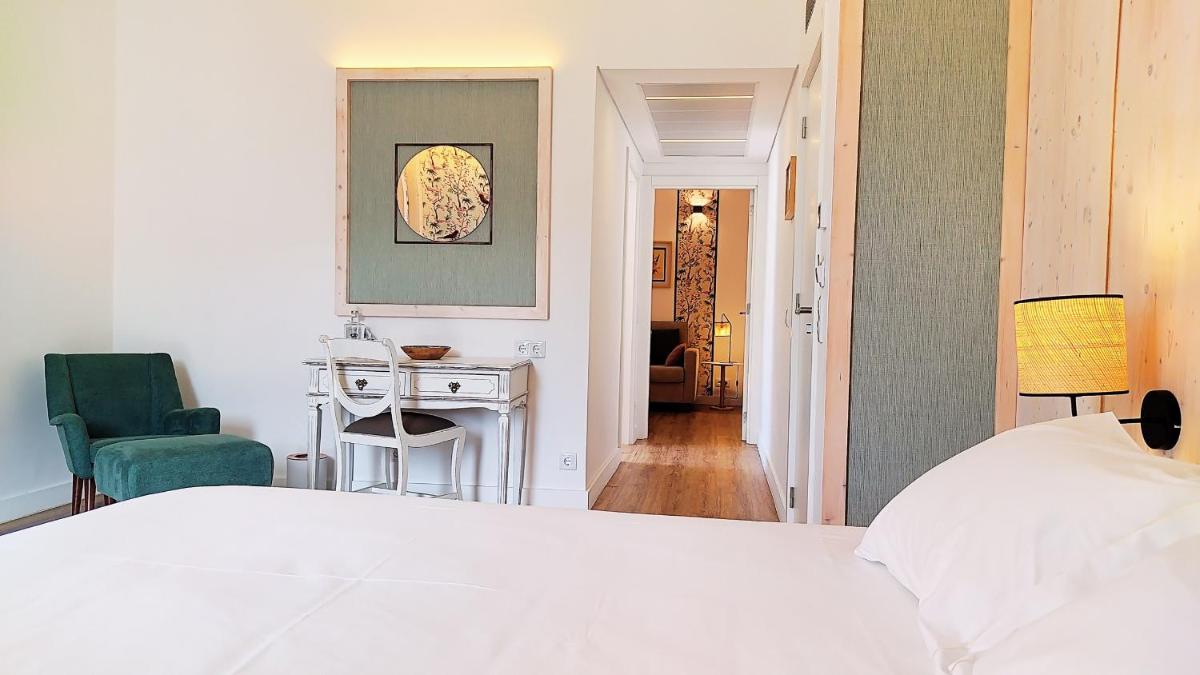 Uma cama ou camas num quarto em Grande Hotel das Caldas da Felgueira