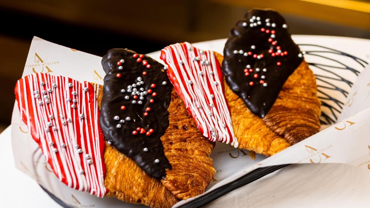 two pieces of bread with candy canes on a plate at Crowne Plaza Today Gurugram by IHG in Gurgaon