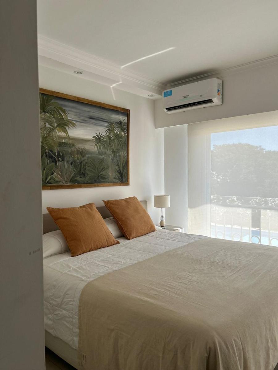 Apart France - Un dormitorio con gim, piscina y estacionamiento - Housity