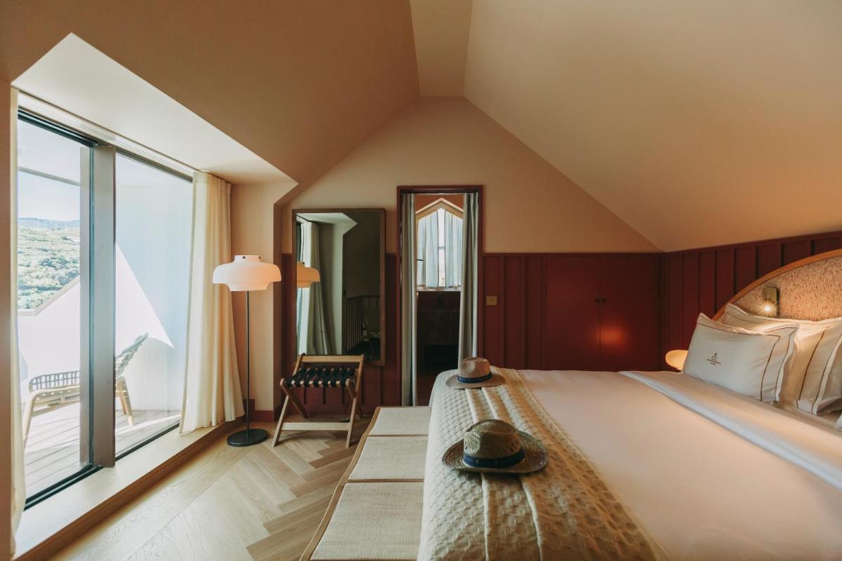 Uma cama ou camas num quarto em Torel Quinta da Vacaria - Douro Valley