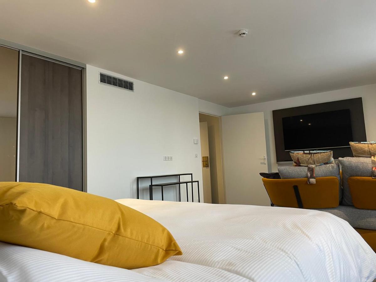 Un ou plusieurs lits dans un hébergement de l'établissement Brit Hotel de Grignan Vichy