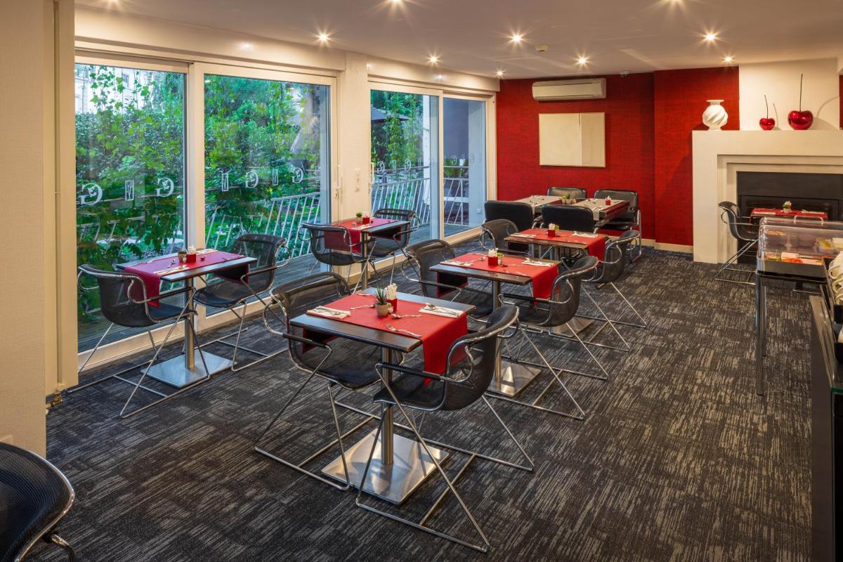 Coin salon dans l'établissement Hôtel Villa La Florangerie - SPA & Piscine