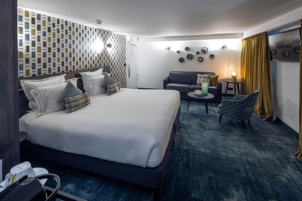 Un ou plusieurs lits dans un hébergement de l'établissement Hôtel Villa La Florangerie - SPA & Piscine