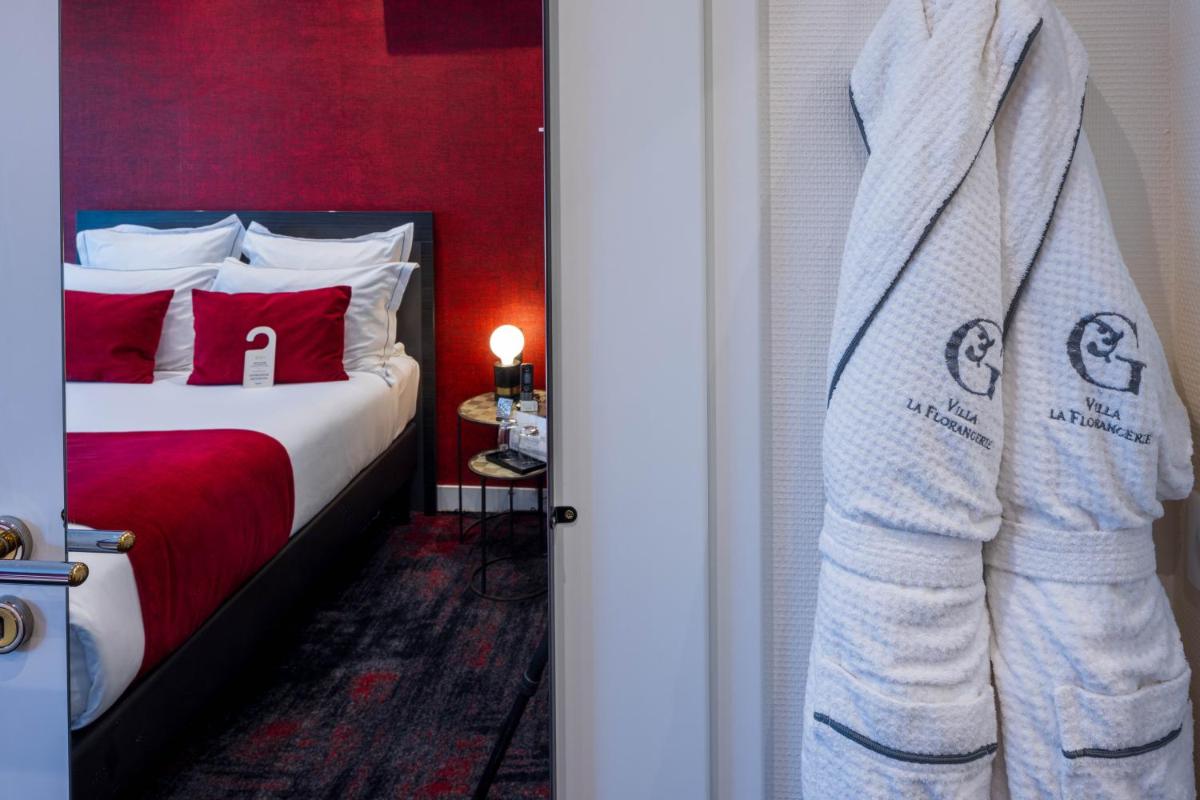 Un ou plusieurs lits dans un hébergement de l'établissement Hôtel Villa La Florangerie - SPA & Piscine