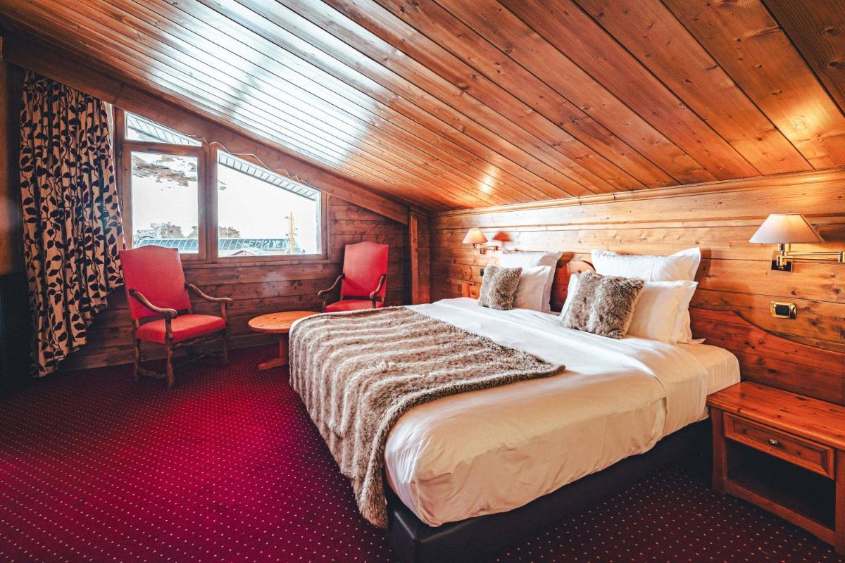 Un ou plusieurs lits dans un hébergement de l'établissement Hotel Mont Vallon