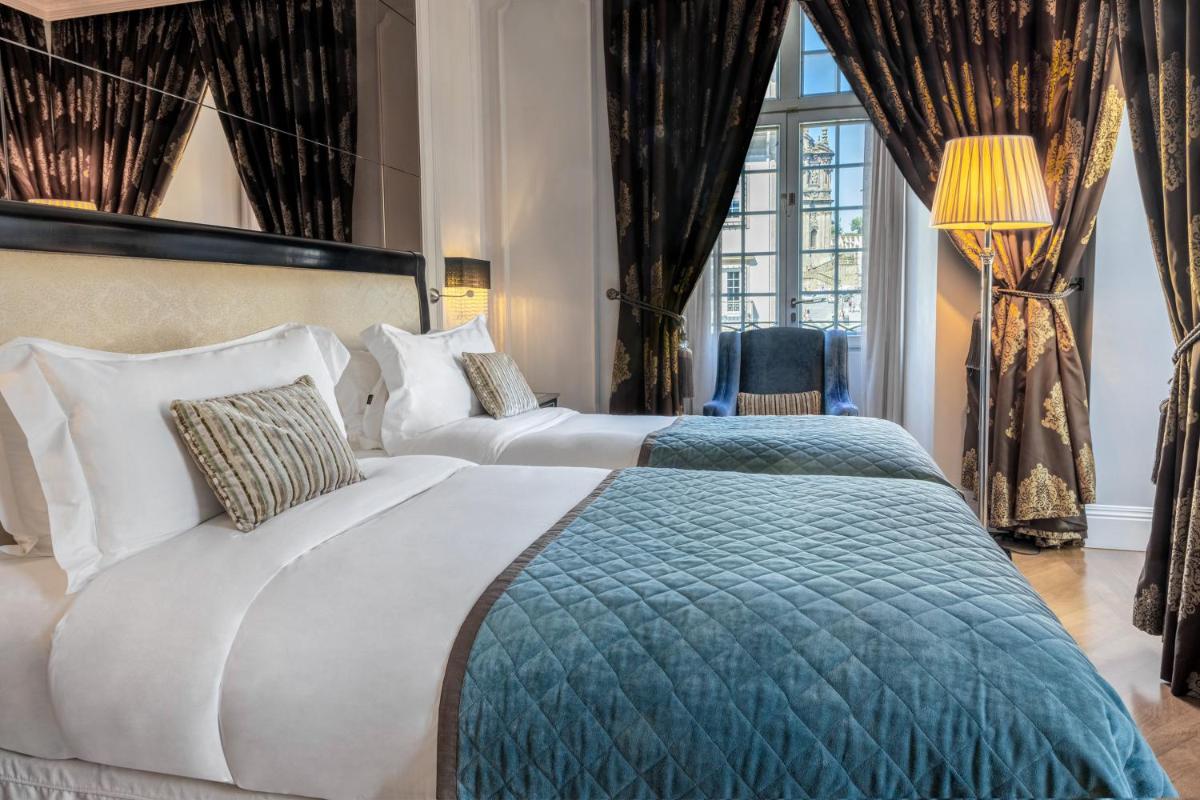 Uma cama ou camas num quarto em InterContinental Porto - Palacio das Cardosas by IHG