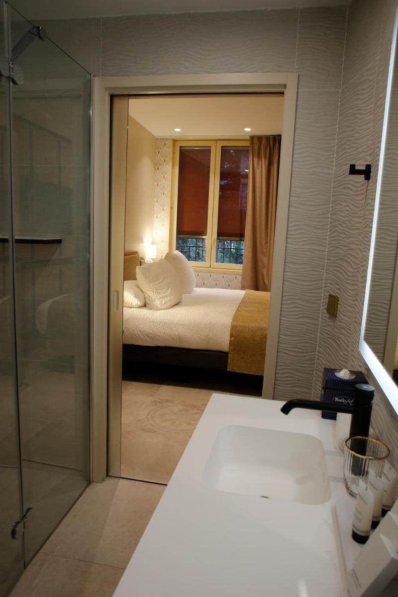 Un ou plusieurs lits dans un hébergement de l'établissement Splendid Hôtel & Spa