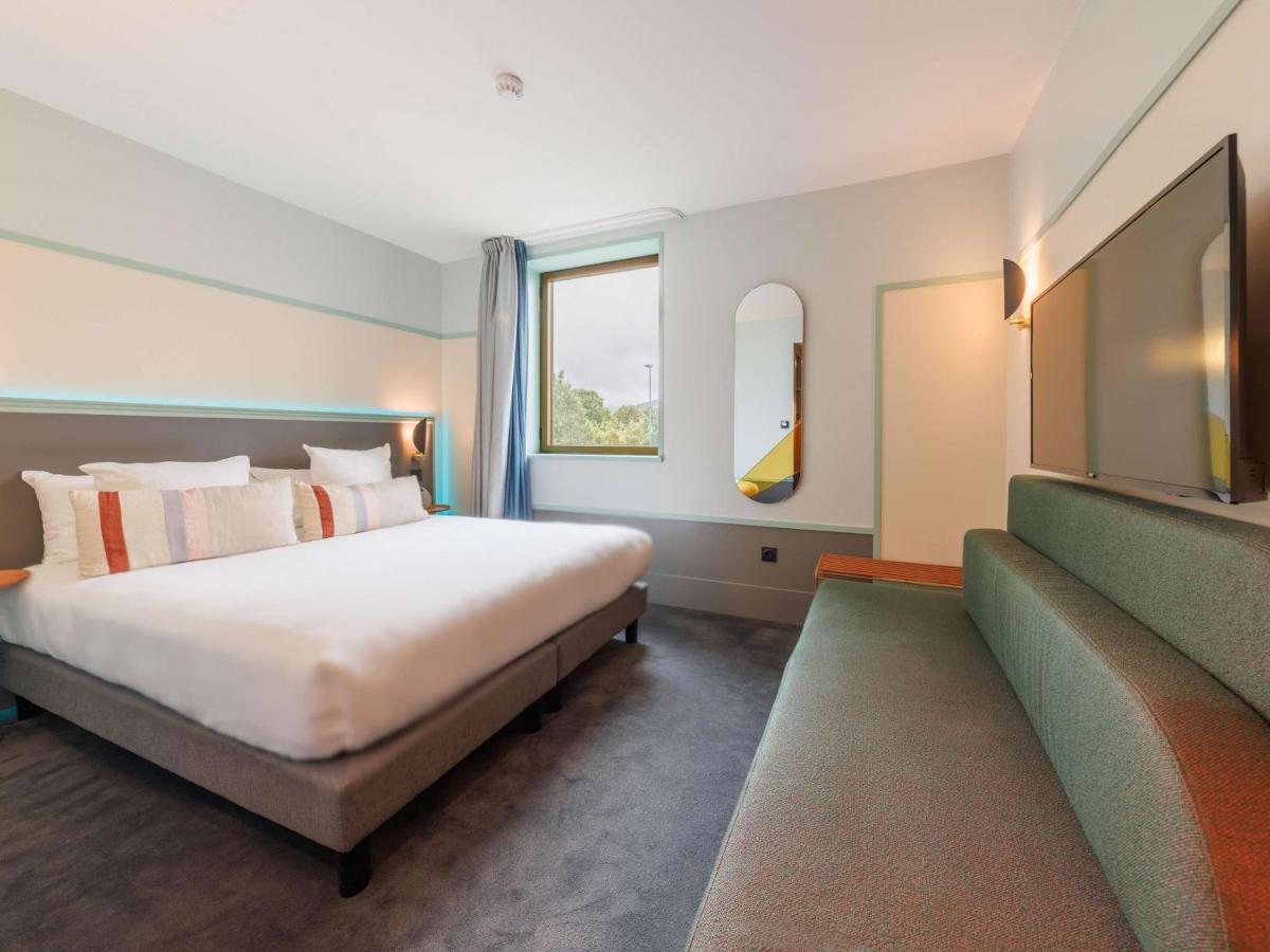 Un ou plusieurs lits dans un hébergement de l'établissement Aiden by Best Western Clermont-Ferrand Hotel & Spa