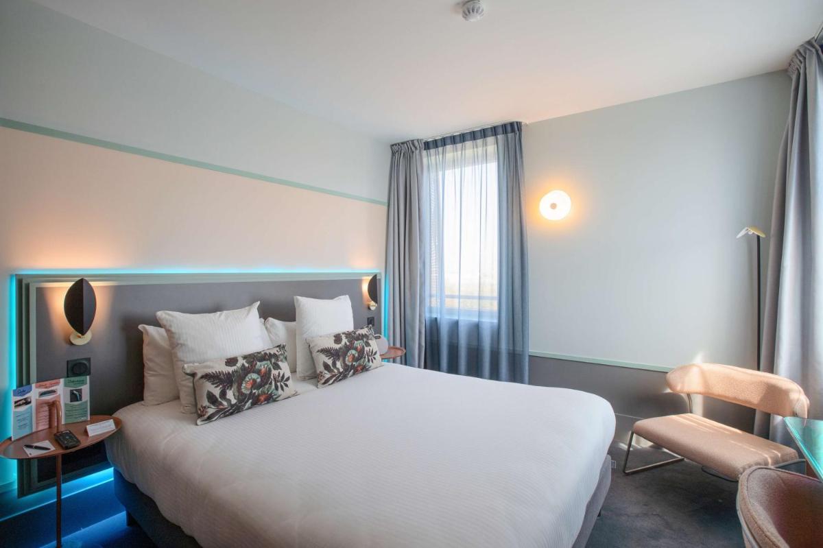 Un ou plusieurs lits dans un hébergement de l'établissement Aiden by Best Western Clermont-Ferrand Hotel & Spa