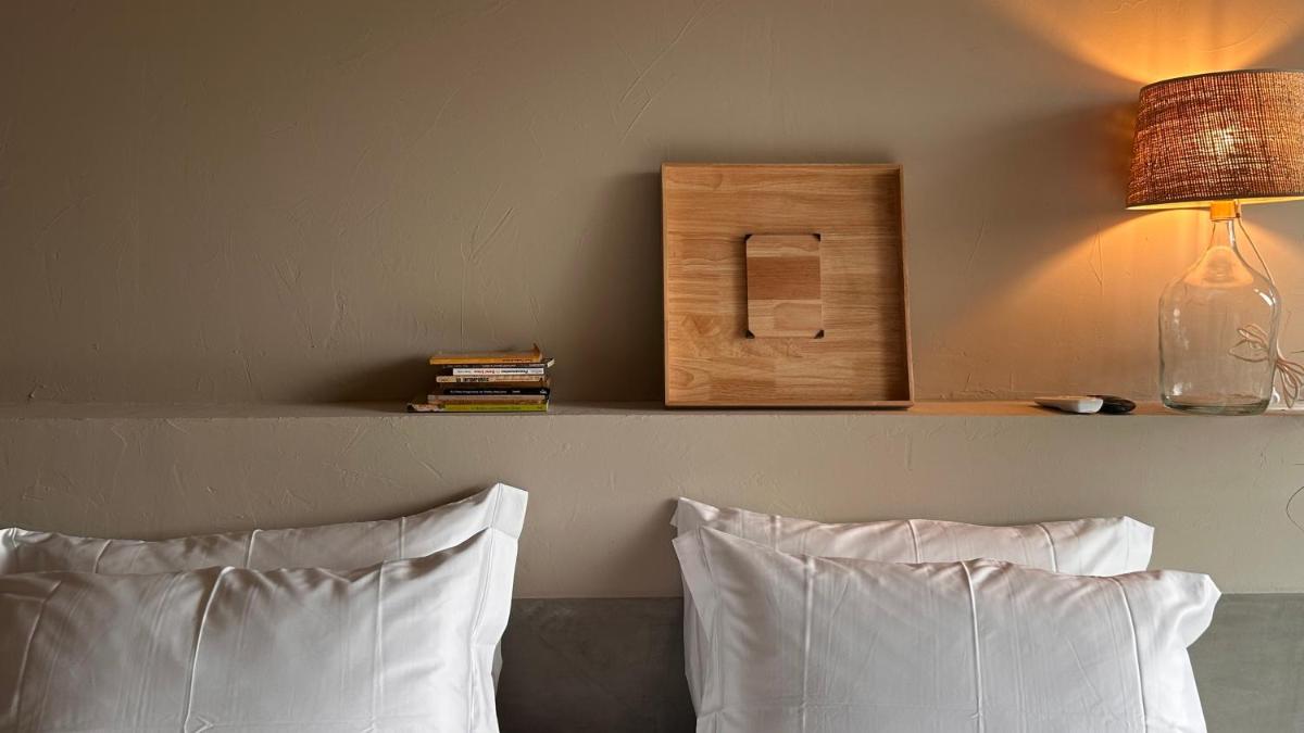 Uma cama ou camas num quarto em Carmo's Boutique Hotel - Small Luxury Hotels of the World