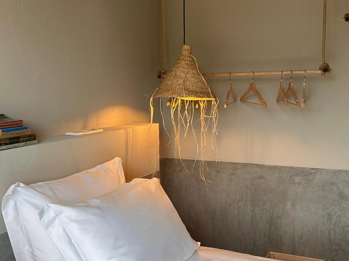 Uma cama ou camas num quarto em Carmo's Boutique Hotel - Small Luxury Hotels of the World