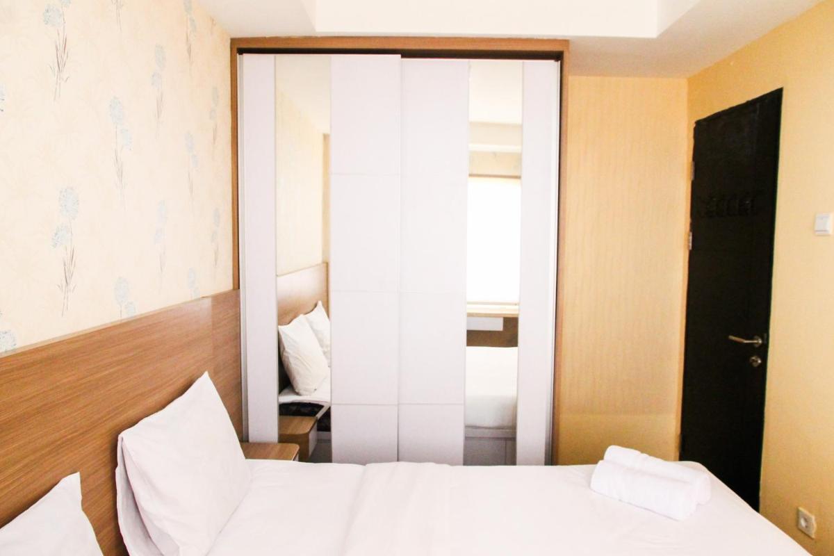 Cozy and Elegant 1BR Apartment Belmont Residence Puri By Travelio - Housity