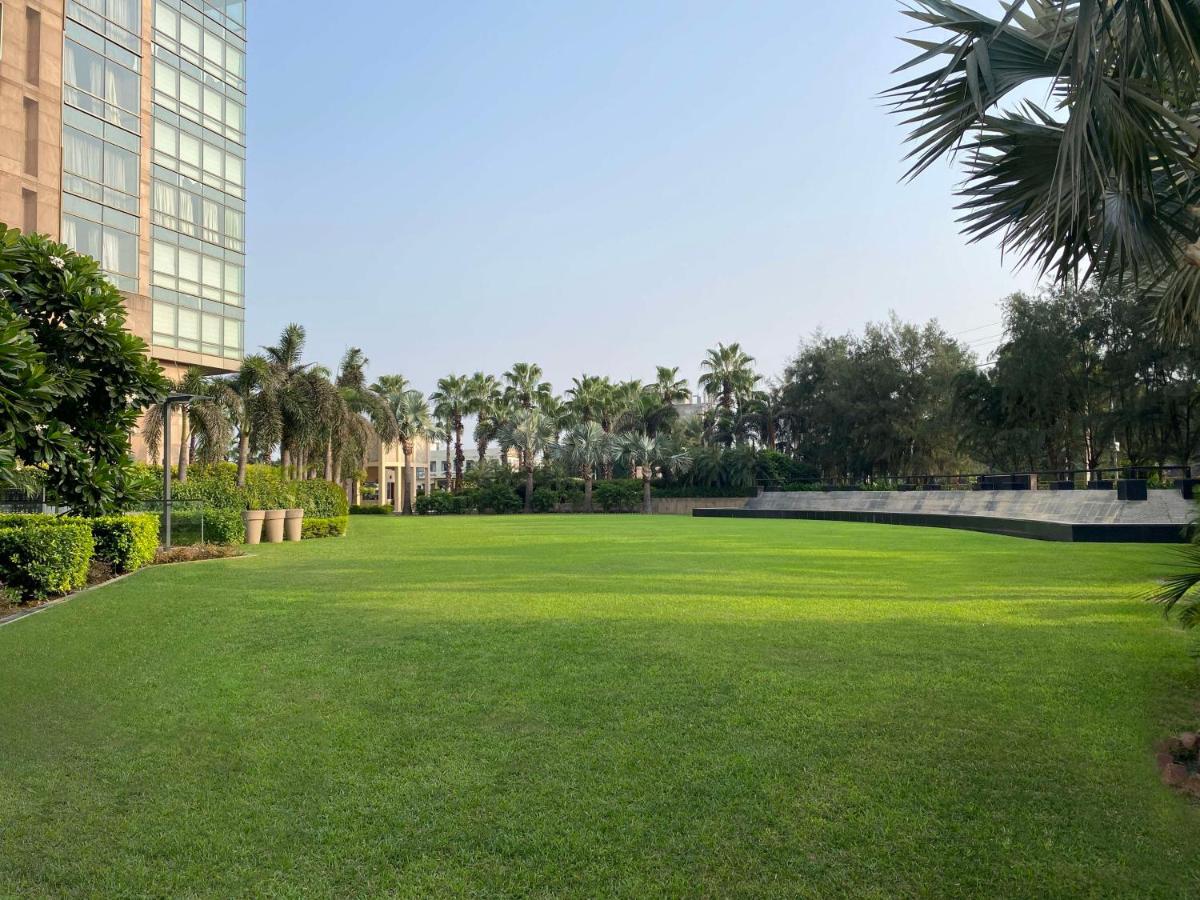 a large lawn in front of a building at Radisson Blu Hotel Amritsar in Amritsar