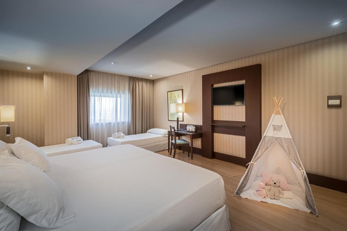 Cama o camas de una habitación en Barceló Granada Congress