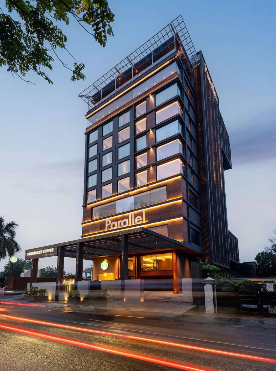 a tall building with a sign on the side of it at Parallel Hotel Udaipur, a member of Radisson Individuals in Udaipur