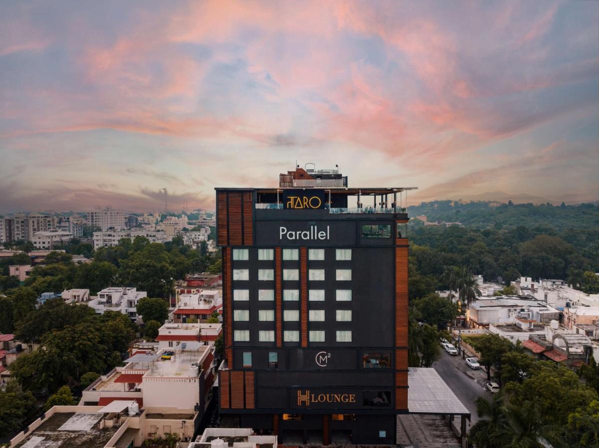 a tall building with a sign on top of it at Parallel Hotel Udaipur, a member of Radisson Individuals in Udaipur
