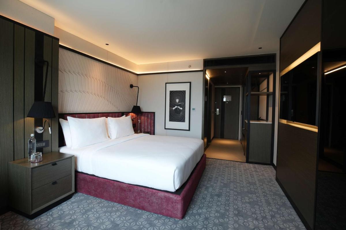 a large white bed in a hotel room at Parallel Hotel Udaipur, a member of Radisson Individuals in Udaipur