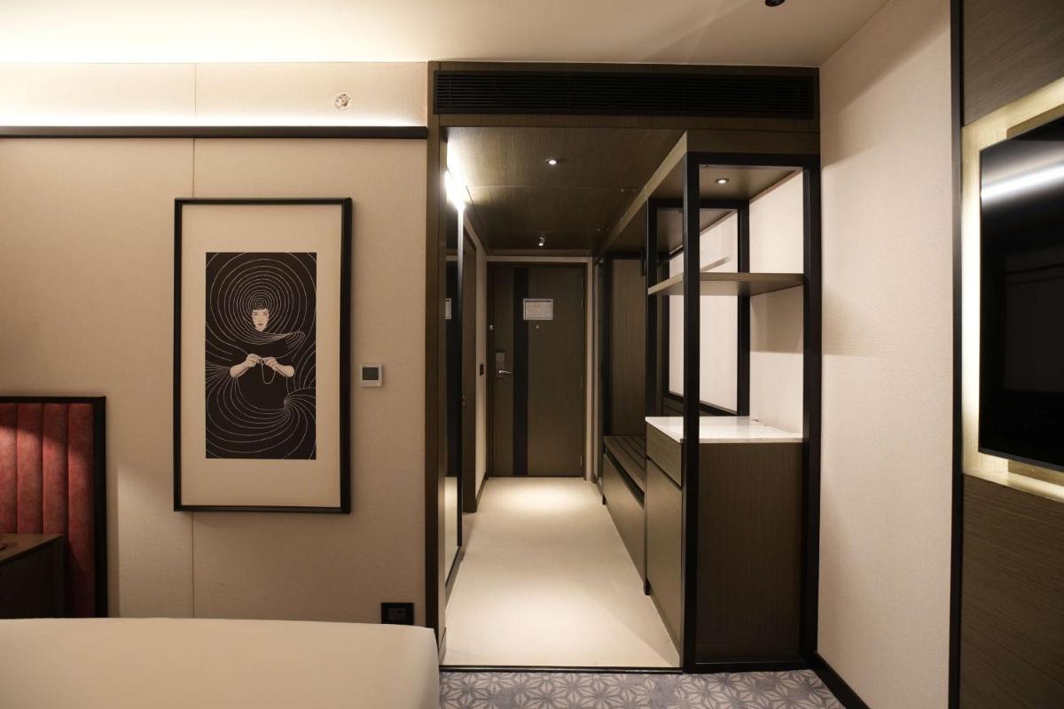 a room with a hallway with a painting on the wall at Parallel Hotel Udaipur, a member of Radisson Individuals in Udaipur