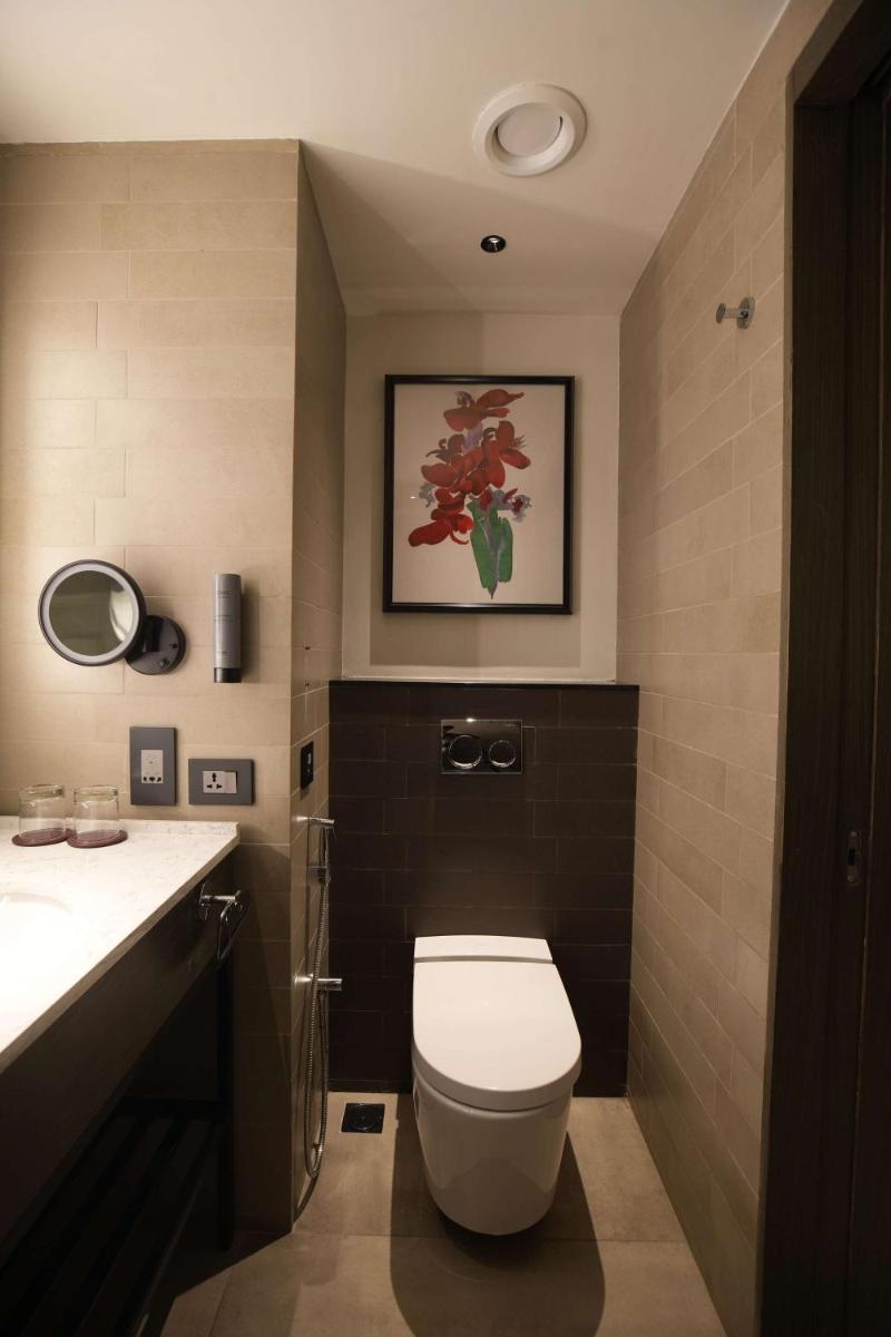 a bathroom with a toilet and a sink at Parallel Hotel Udaipur, a member of Radisson Individuals in Udaipur