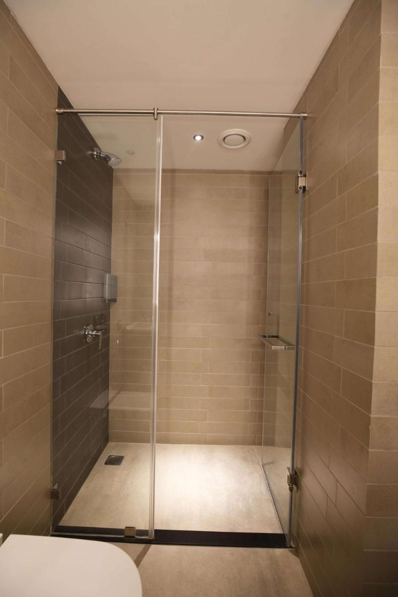 a shower with a glass door in a bathroom at Parallel Hotel Udaipur, a member of Radisson Individuals in Udaipur
