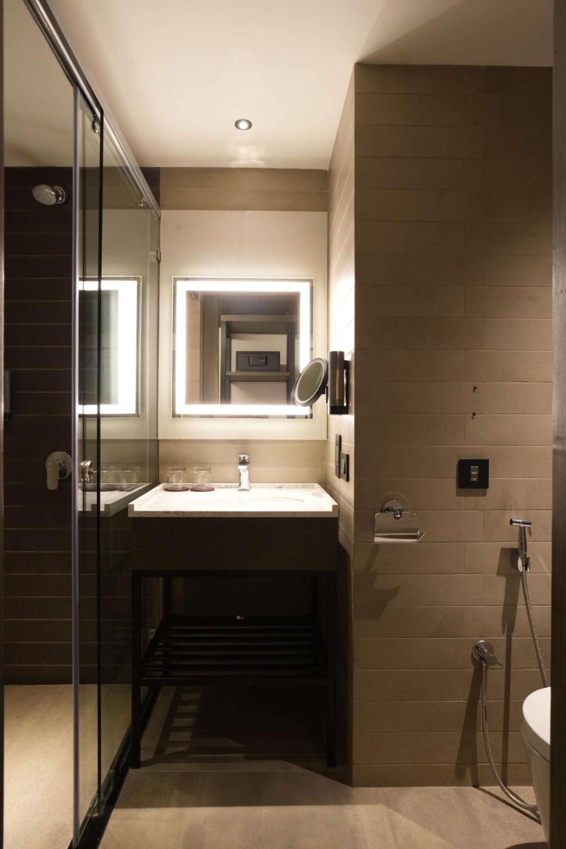 a bathroom with a sink and a mirror at Parallel Hotel Udaipur, a member of Radisson Individuals in Udaipur