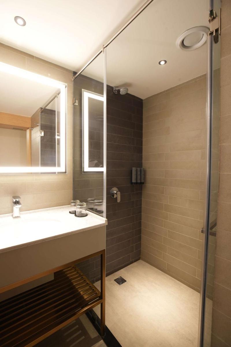 a bathroom with a sink and a shower at Parallel Hotel Udaipur, a member of Radisson Individuals in Udaipur