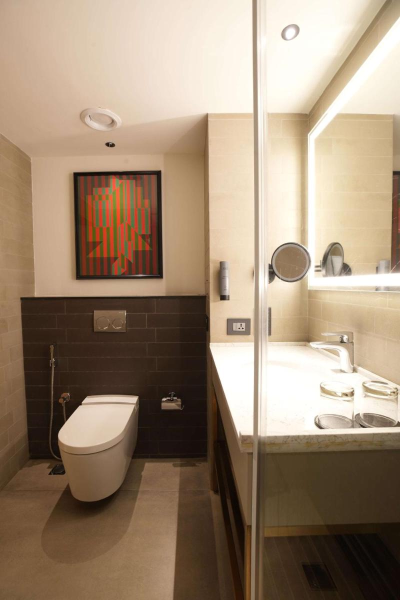 a bathroom with a toilet and a sink at Parallel Hotel Udaipur, a member of Radisson Individuals in Udaipur