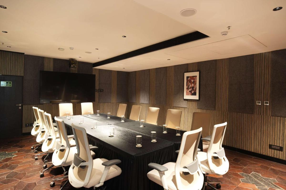 a conference room with a long table and chairs at Parallel Hotel Udaipur, a member of Radisson Individuals in Udaipur