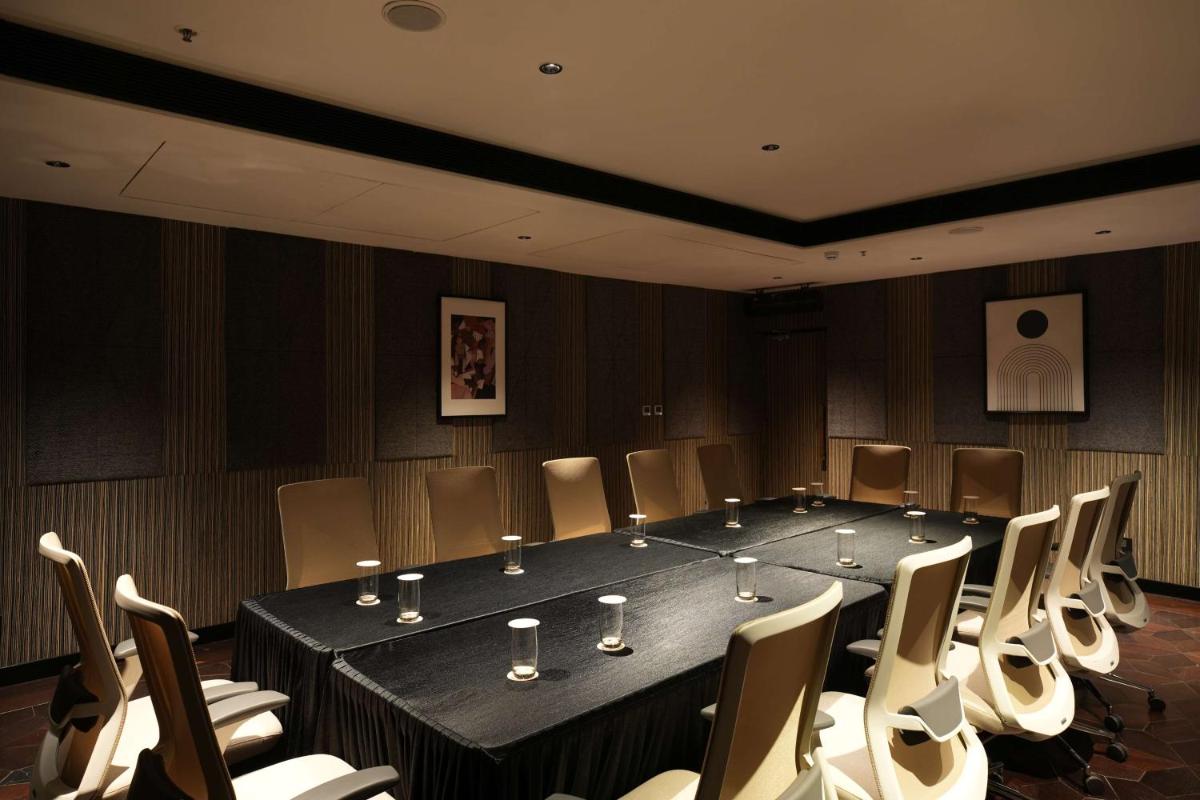 a conference room with a large table and chairs at Parallel Hotel Udaipur, a member of Radisson Individuals in Udaipur