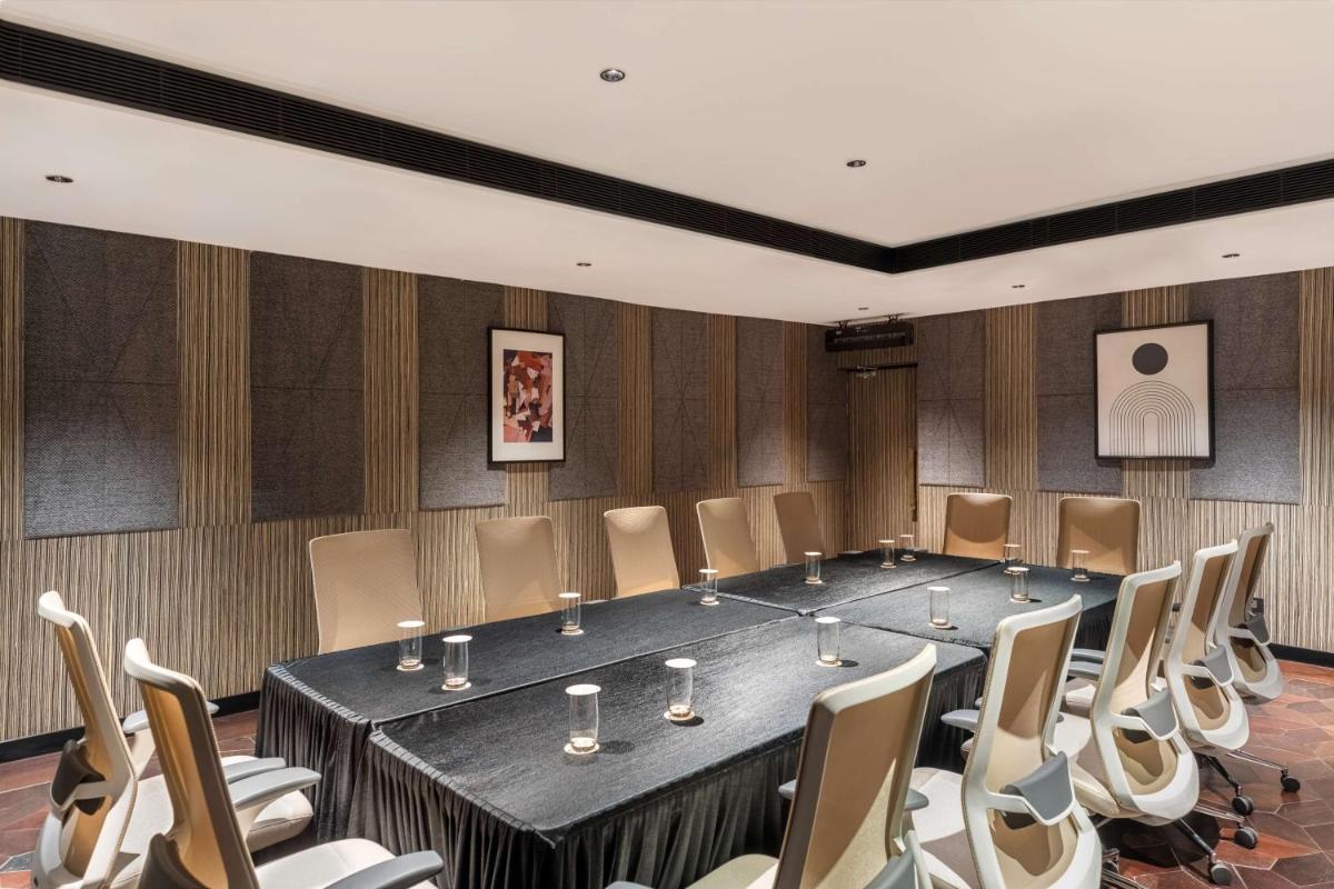 a meeting room with a large table and chairs at Parallel Hotel Udaipur, a member of Radisson Individuals in Udaipur