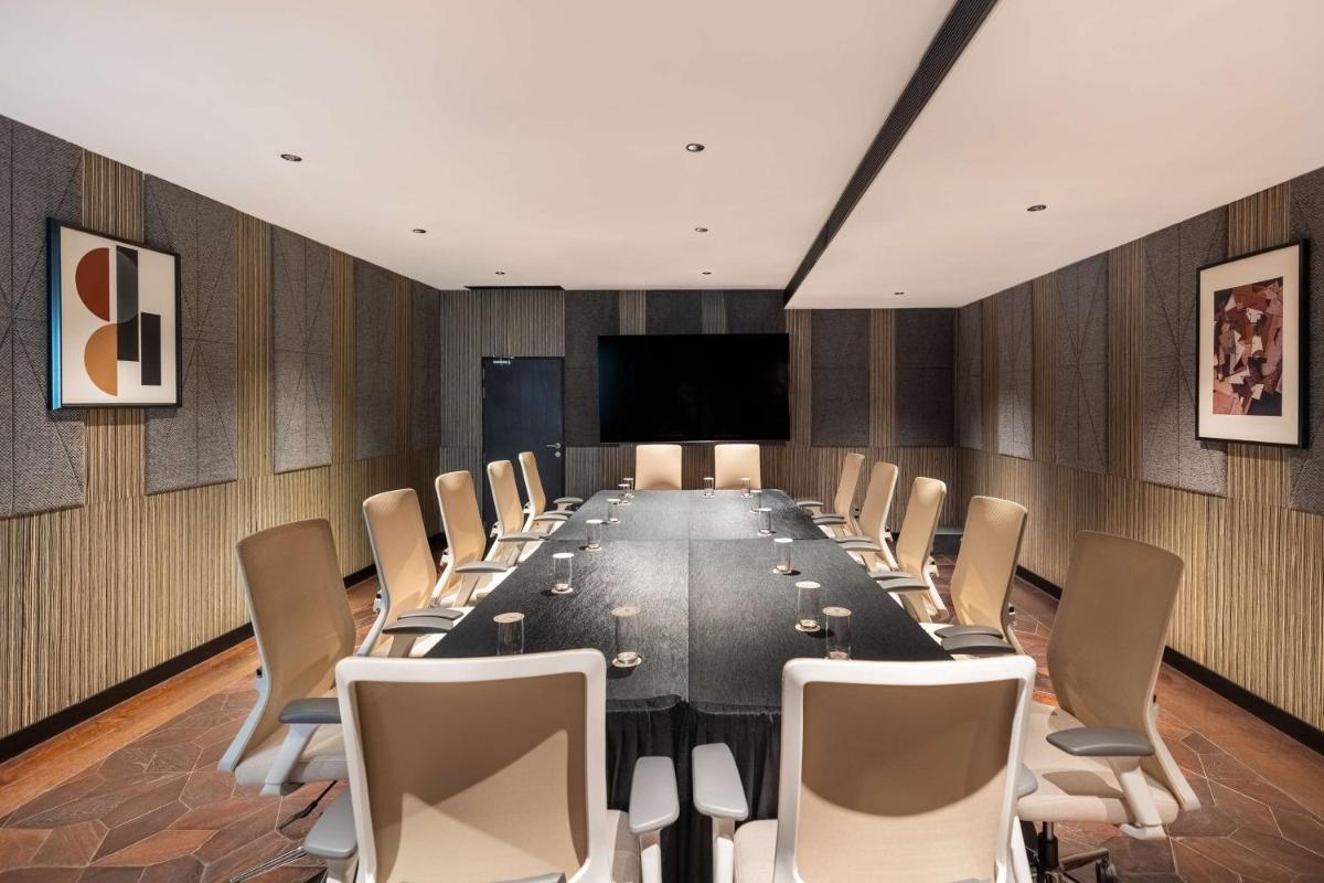 a conference room with a long table and chairs at Parallel Hotel Udaipur, a member of Radisson Individuals in Udaipur