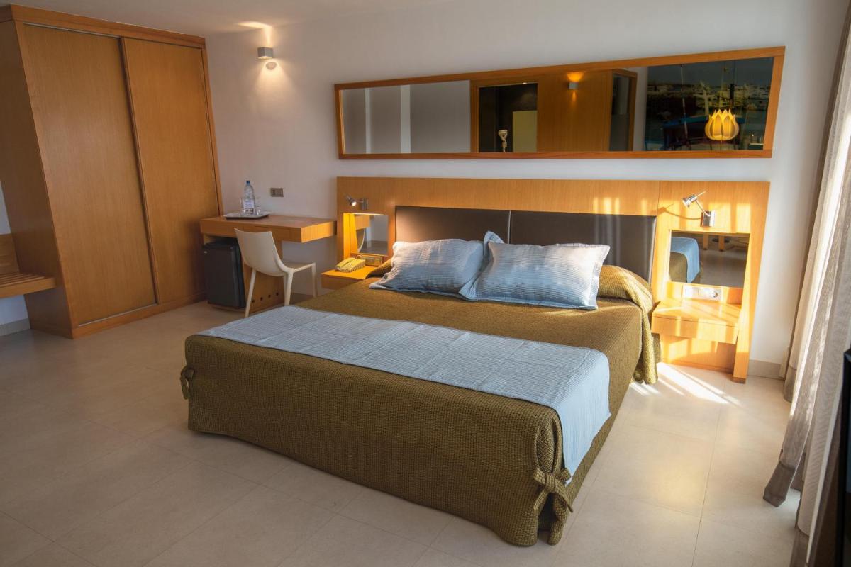 Cama o camas de una habitación en R2 Bahia Playa - Adults Only