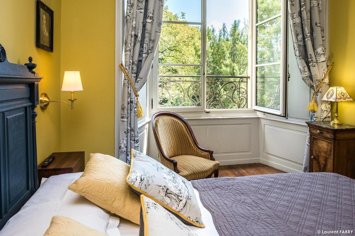 Un ou plusieurs lits dans un hébergement de l'établissement Château de Maillat