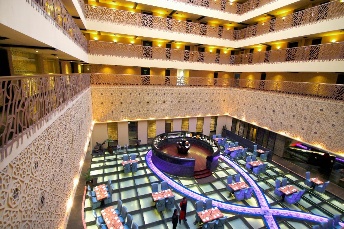 an overhead view of a hotel lobby with a track at Sterlings Mac Hotel in Bengaluru