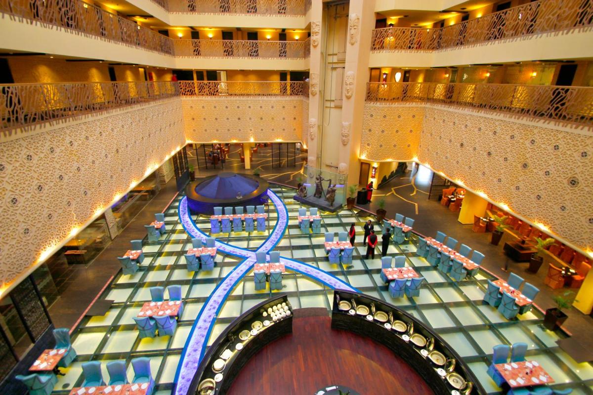 an overhead view of a shopping mall with a pool at Sterlings Mac Hotel in Bengaluru