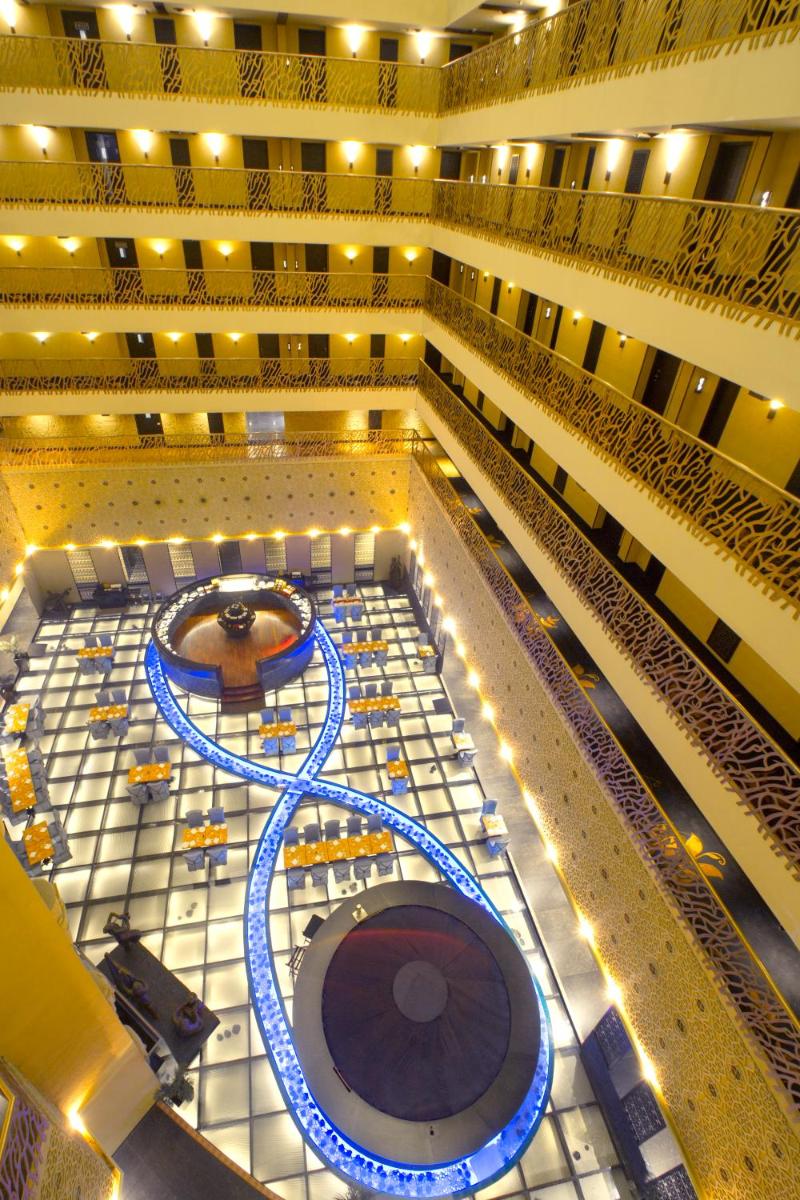a view of a large building with a stage at Sterlings Mac Hotel in Bengaluru