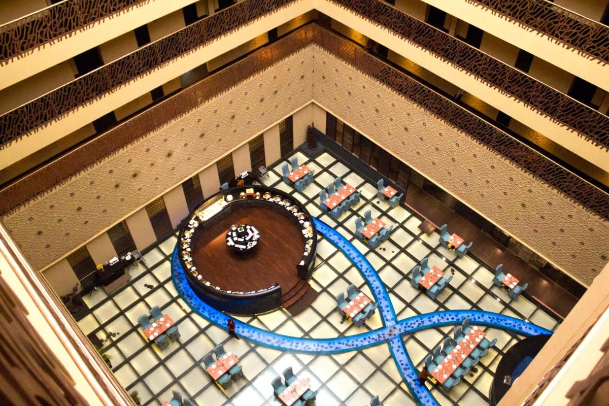 an overhead view of a building with a cake on a floor at Sterlings Mac Hotel in Bengaluru