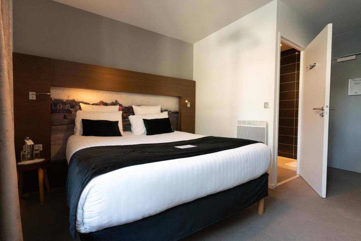 Un ou plusieurs lits dans un hébergement de l'établissement Best Western Hôtel Garden and Spa