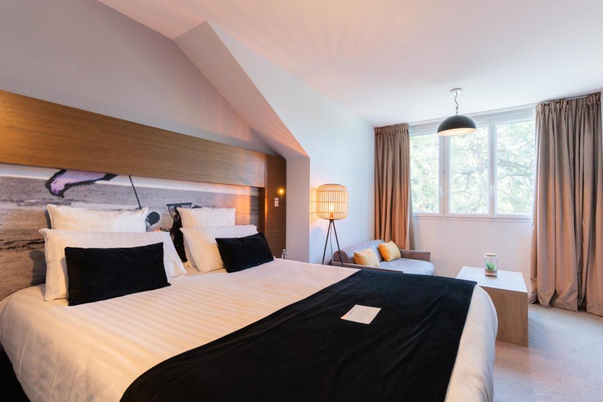 Un ou plusieurs lits dans un hébergement de l'établissement Best Western Hôtel Garden and Spa