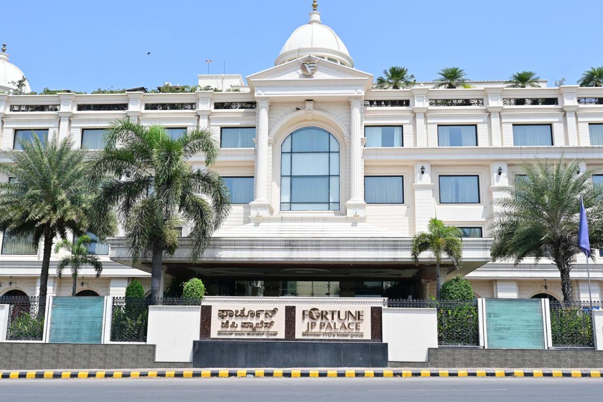 a white building with a sign in front of it at Fortune JP Palace, Mysore - Member ITC Hotels' Group in Mysore