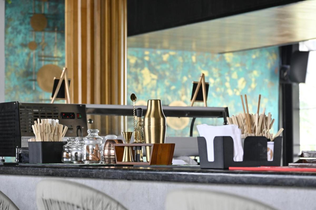 a counter top with chopsticks and utensils at Fortune JP Palace, Mysore - Member ITC Hotels' Group in Mysore