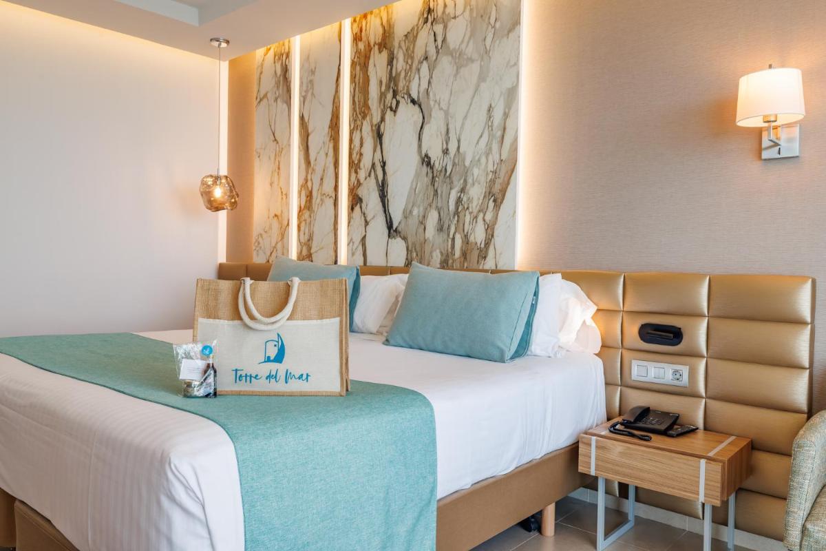 Cama o camas de una habitación en Hotel Torre del Mar - Ibiza