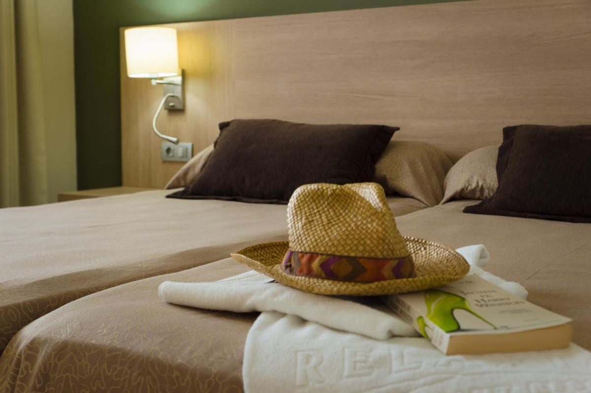Cama o camas de una habitación en Relaxia Lanzasur Club - Aqualava Water Park