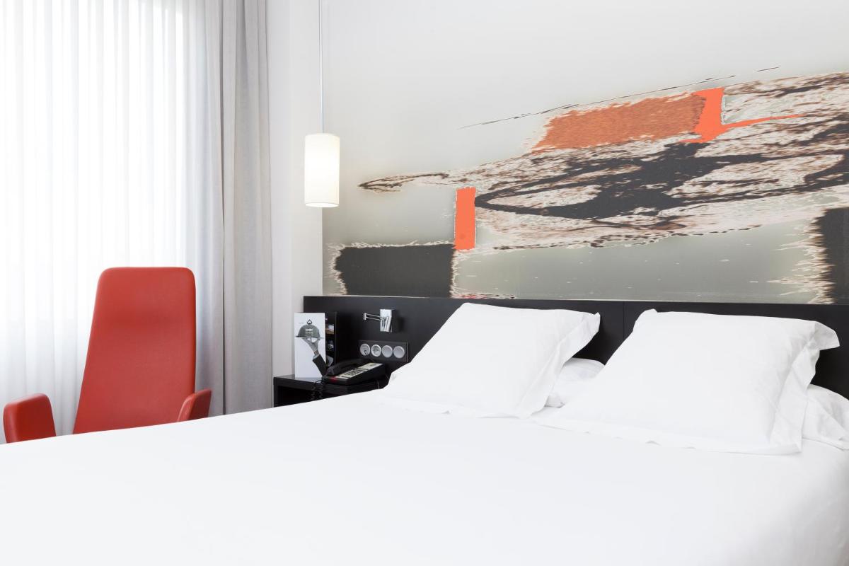 Cama o camas de una habitación en Axor Barajas
