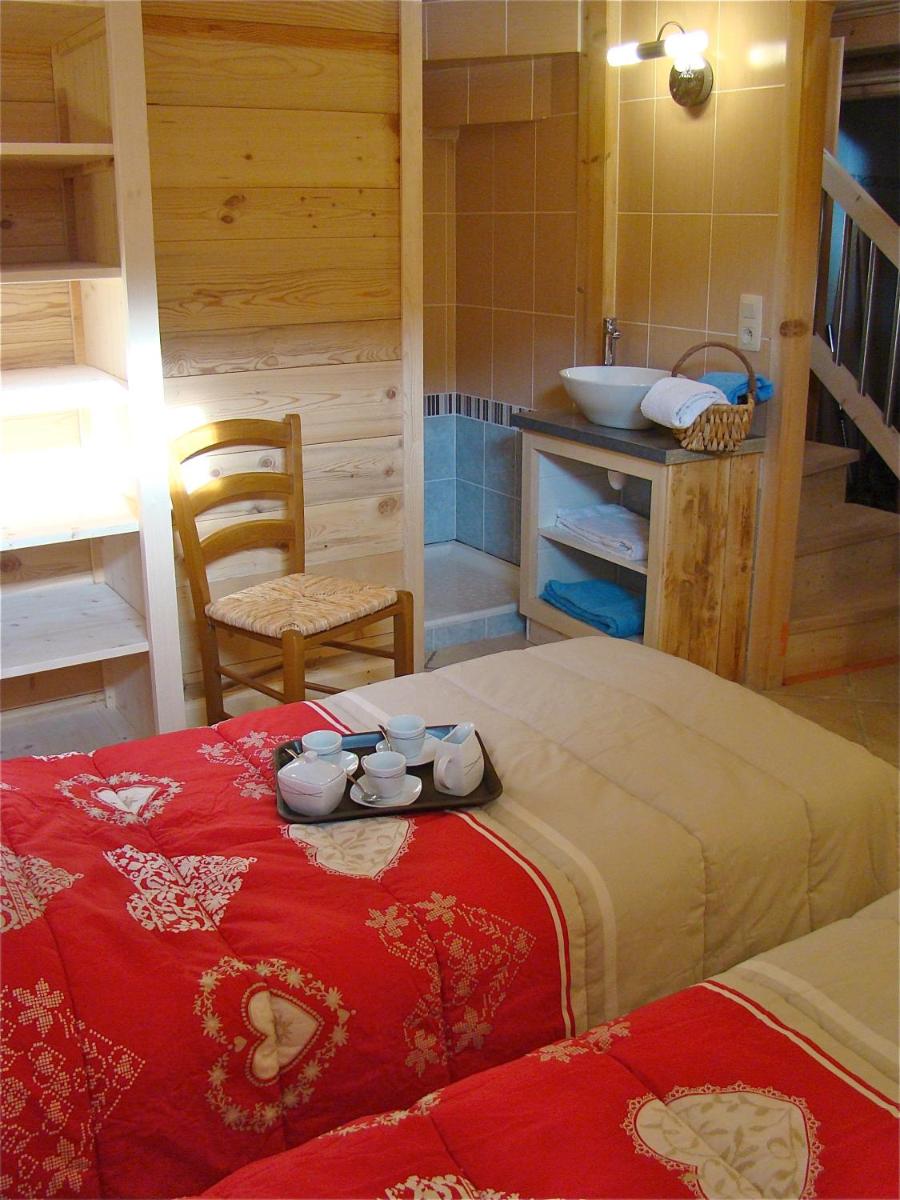 Un ou plusieurs lits dans un hébergement de l'établissement Apart'hotel & Spa "La Destière"