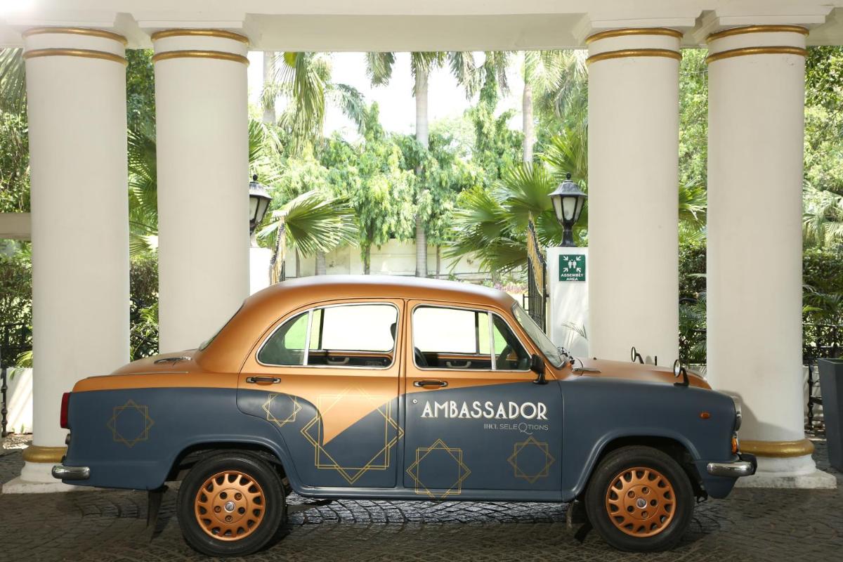 an old car parked in front of a building at Ambassador, New Delhi - IHCL SeleQtions in New Delhi an old car parked in front of a building at Ambassador, New Delhi - IHCL SeleQtions in New Delhi